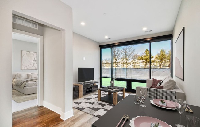 a living room with a couch and a table and a tv