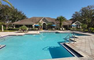 Outdoor saltwater pool with sundeck and grills