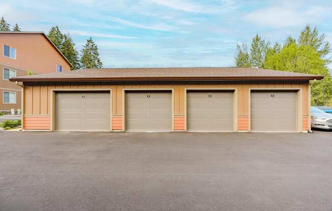 A two-car garage with a brown roof and tan walls.