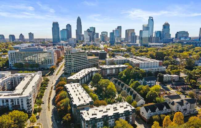 Flatiron West Trade Apartments aerial view with Charlotte skyline in background