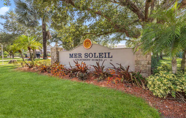 A sign that says Mer Soleil in front of a building.