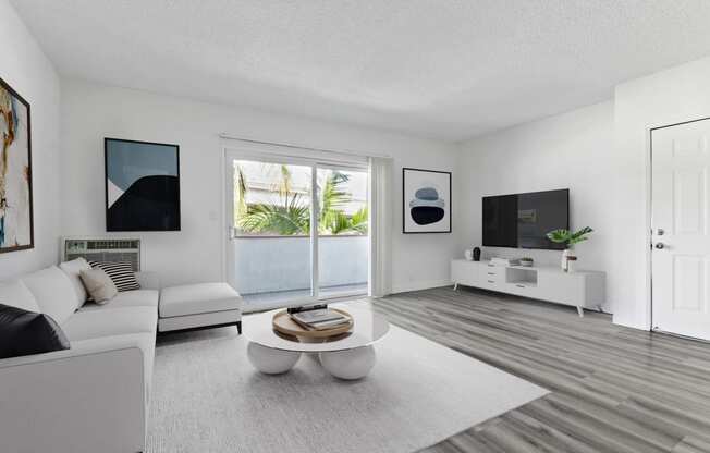 a living room with a white couch and a coffee table