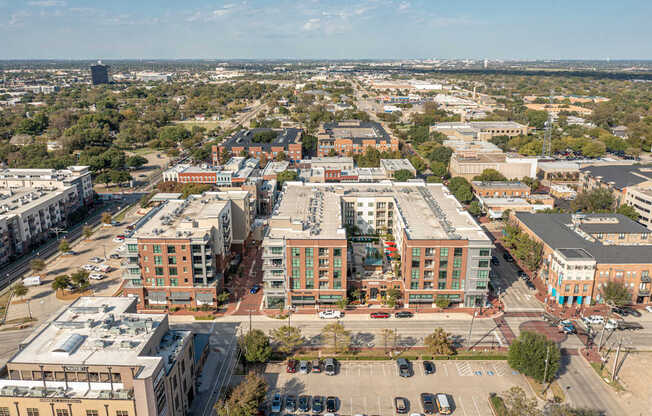A cityscape with buildings and cars.