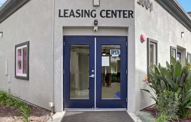 A leasing center with a blue door