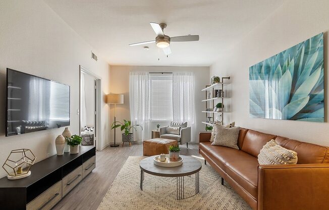 a living room with a couch and a ceiling fan at Element Deer Valley, Phoenix, 85027