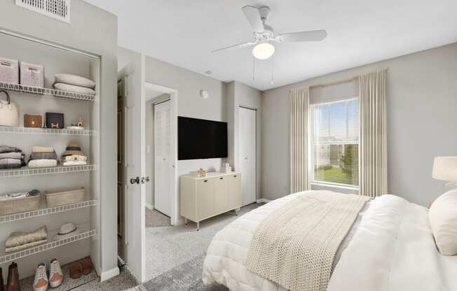 a bedroom with a large bed and a closet