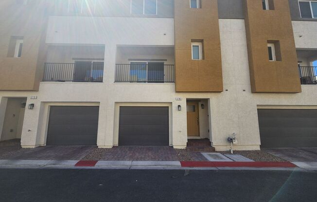 Modern three-story townhome in exclusive Panorama gated community.