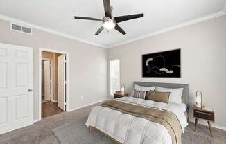 Model Bedroom with Carpet and Window View at Allure North Dallas Apartments located in Dallas, TX.