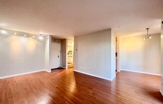 Spacious 1 bedroom with wood laminate flooring, updated kitchen, and 1 parking spot included!