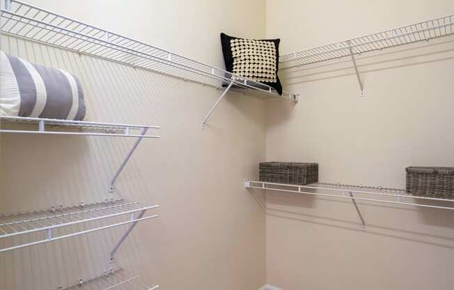 a spacious walk in closet at the whispering winds apartments in pearland, tx