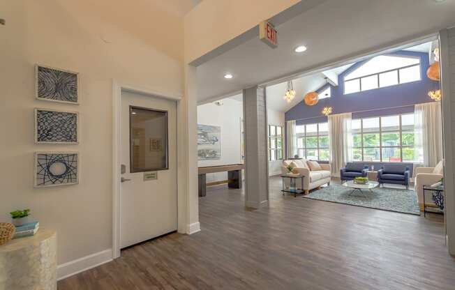 the view of the living room from the foyer of a new home