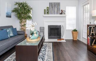 Luxurious Living Room Remodel With Standard Fireplace at Wildwood Apartments, CLEAR Property Management, Austin, TX, 78752