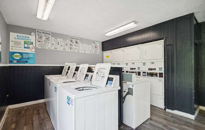 the laundry room is equipped with washers and dryers