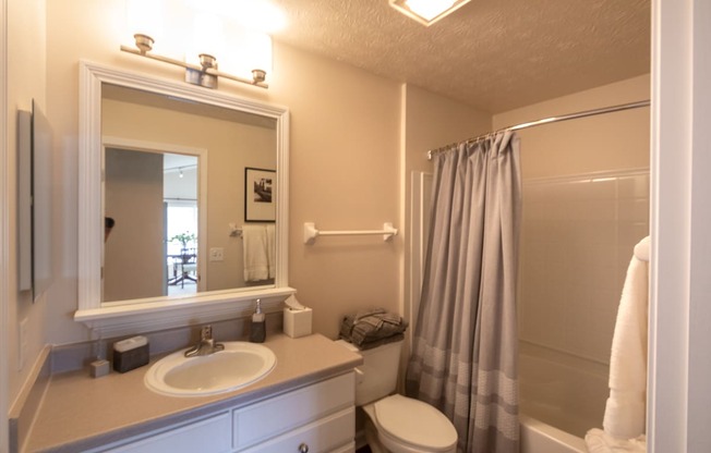 This is a photo of the primary bathroom  in the 1016 square foot, 2 bedroom, 2 bath Nautica floor plan at Nantucket Apartments in Loveland, OH.