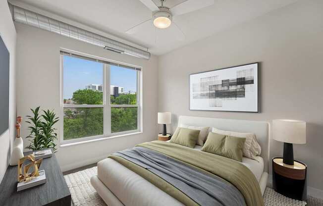 A bedroom with a large bed and a ceiling fan.
