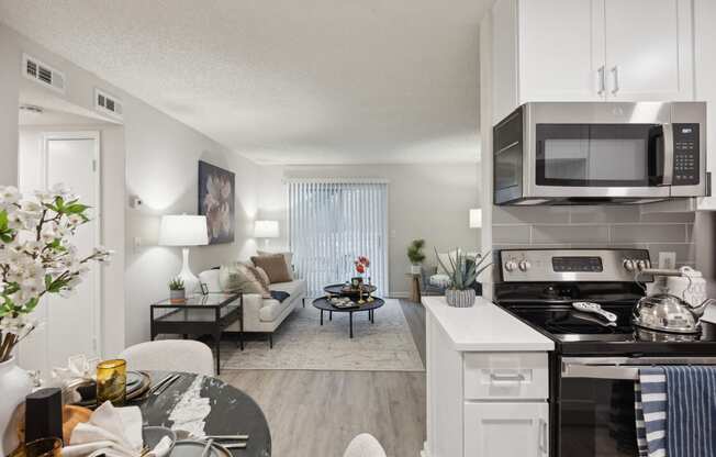 our apartments offer a spacious living room with a kitchen and dining area at St. Andrews Reserve, North Carolina, 28412