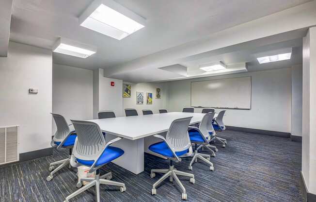 a conference room with a long table and chairs