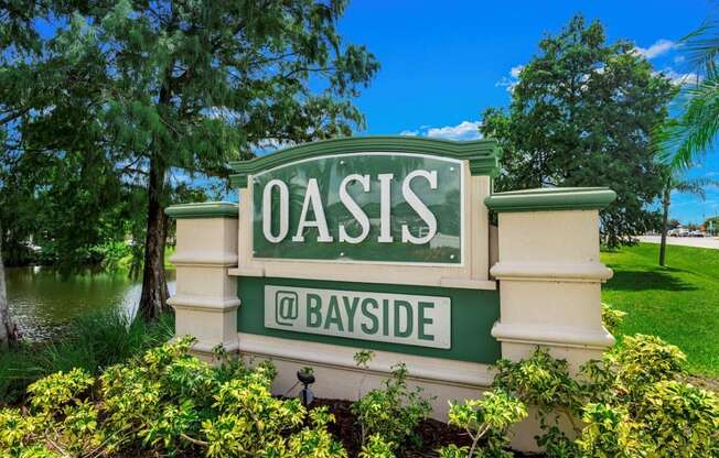 Property sign at Oasis at Bayside Apartments in Largo, FL