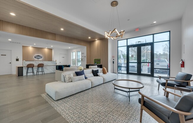 Elevate your lifestyle at Crossings @ 501 Apartments. This stunning lounge area combines modern design with comfort, perfect for relaxation or socializing. Don't miss out on this inviting community—schedule your tour today!