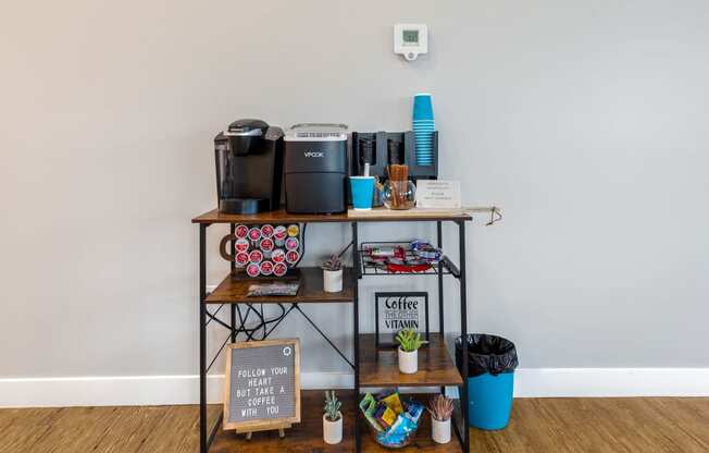 a shelf with coffee machines and other items on it