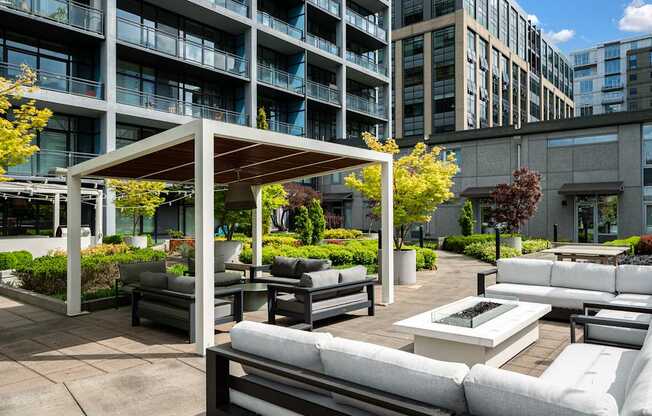 A patio area with white furniture and a canopy.
