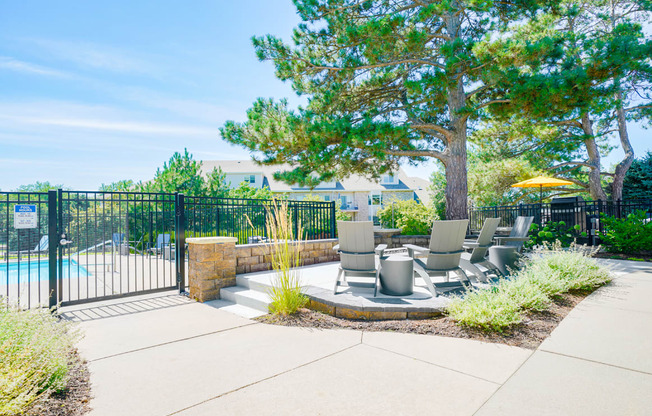 Fire pit with chairs outside of the gated community pool