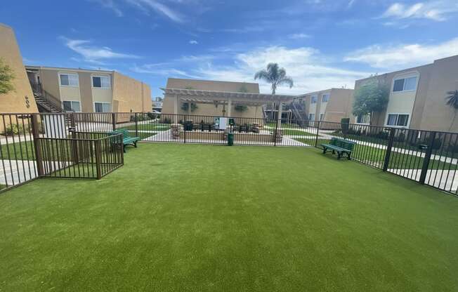 Dog Park and Outdoor Shaded Seating at Whiffle Tree Apartment homes in Huntington Beach, CA.