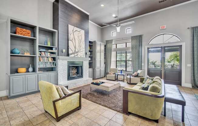 a living room with furniture and a fireplace