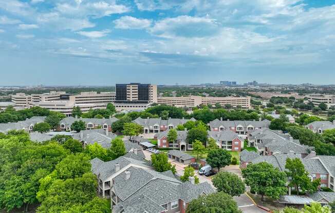 an aerial view of a neighborhood with houses and trees