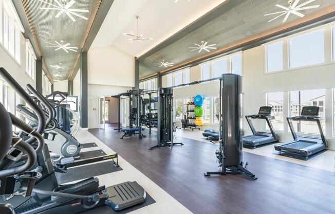 Premium Fitness Studio featuring cardio equipment, free-weights, state of the art equipment, including boxing zone and spin bikes.
