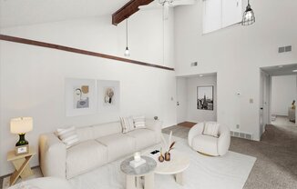 a living room with white walls and a white couch