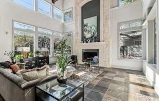 A living room with a fireplace and a couch.