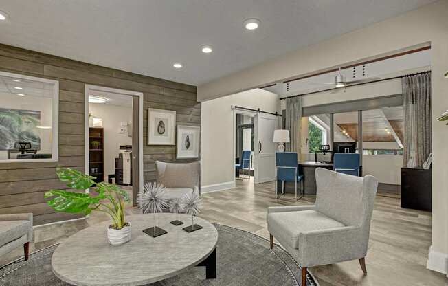 A living room with a grey sofa, a grey armchair, a grey coffee table, a grey rug, a grey plant, a grey lamp, a grey wall, a grey door, a grey curtain, a grey floor, a
