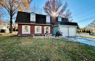 Wonderful Four Bedroom Home in Overland Park w/ Wood Floors, Updated Kitchen, Beautiful Primary Bath, Finished Basement and a Fenced Yard!