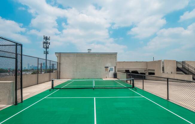 a tennis court on the roof of a building