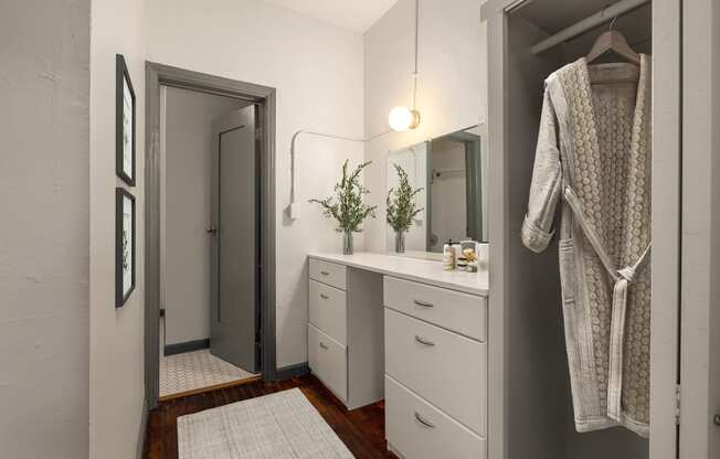a small bathroom with a sink and a mirror at Del Mor Apartments, California, 90026