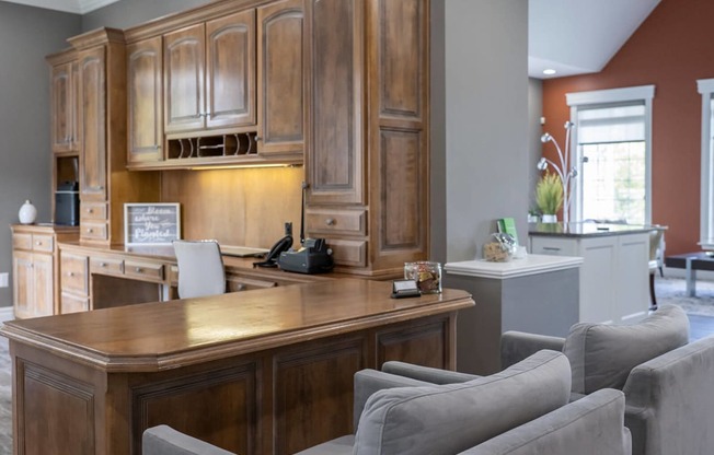 a home office with a desk and chairs