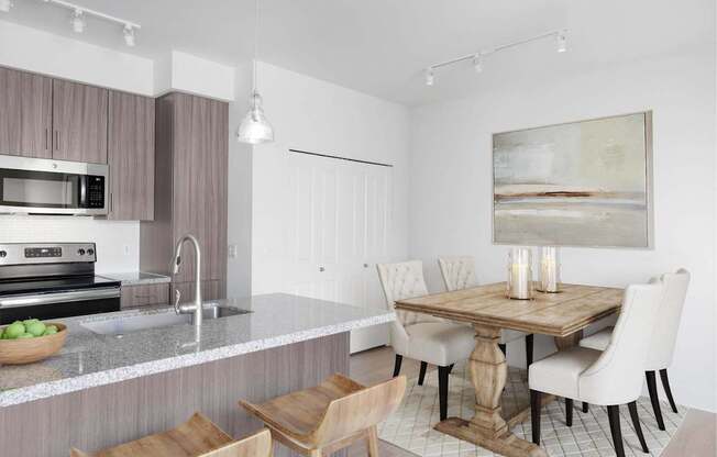 A modern kitchen with a wooden table and chairs.