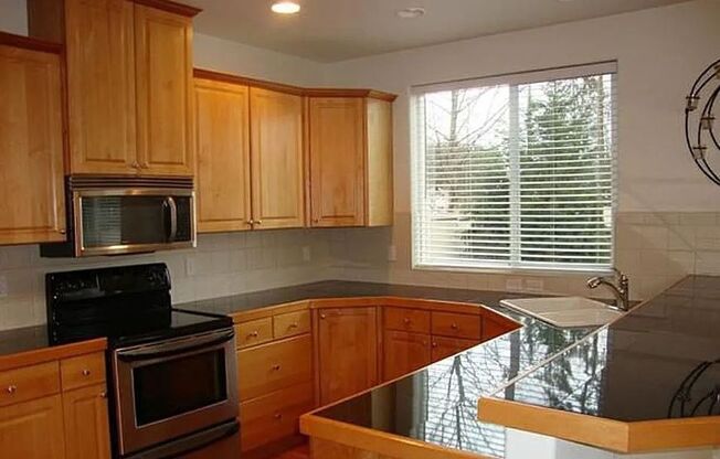 Gorgeous-Hardwoods-Open-Beautiful-Stainless-Granite