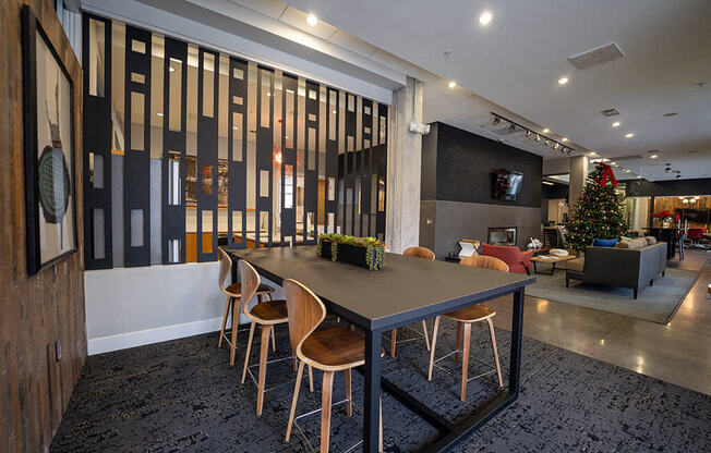 a dining room table with chairs in a lobby