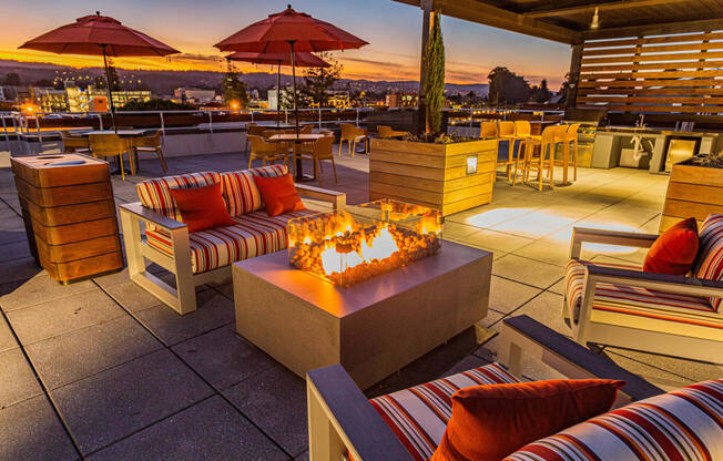Rooftop lounge seating with fire pit at Bayswater Apartments, Burlingame, CA
