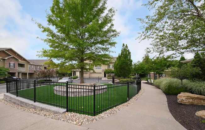 the view of a yard with a wrought iron fence at Sovereign at Overland Park, Overland Park, 66213  