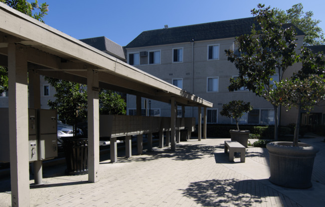 A sunny day at the outdoor seating area of a building.