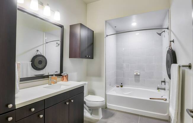 Spacious Bathrooms with Granite Countertops at 1000 Grand by Windsor, 90015, CA