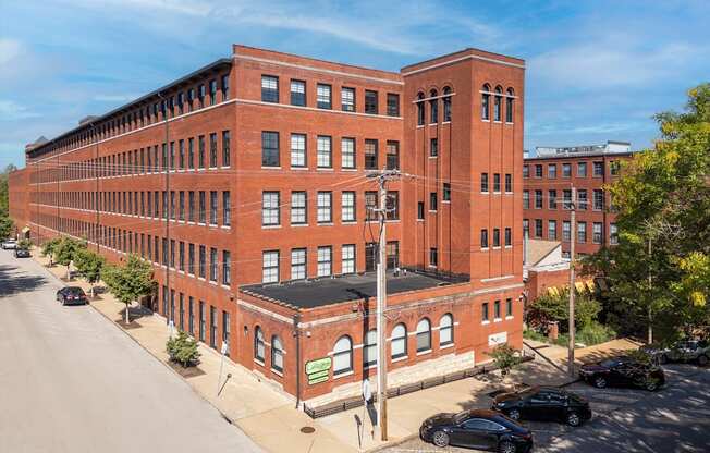 an overhead view of a large brick building on a city street