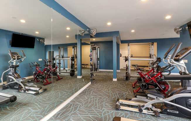 Fitness center with free weights and exercise equipment  at OceanAire Apartment Homes, Pacifica, CA, 94044