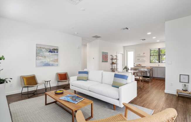 a living room with a white couch and a coffee table at Odyssey, Florida