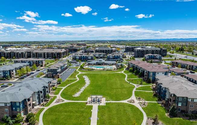an aerial view of a city park with houses and green grass at Arbour Commons, Colorado, 80023