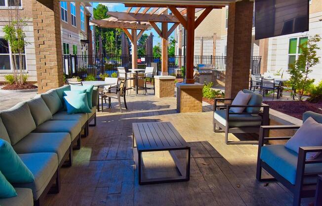 Outdoor Pointe at Lake CrabTree Grill With Intimate Seating Area in North Carolina Apartments for Rent