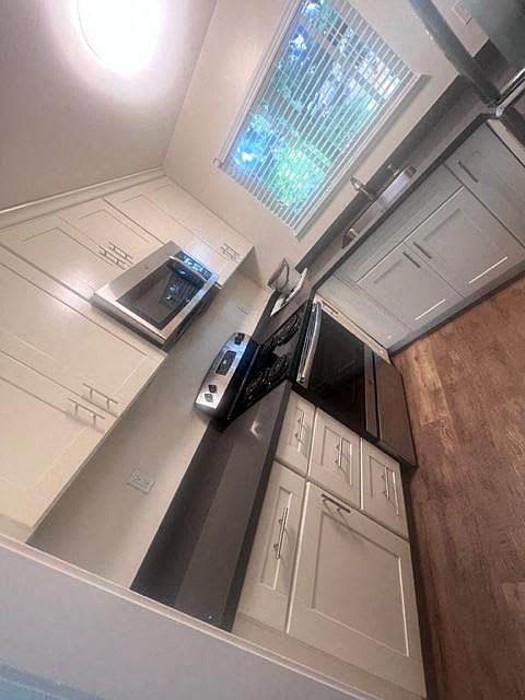 a kitchen with a counter top and a microwave